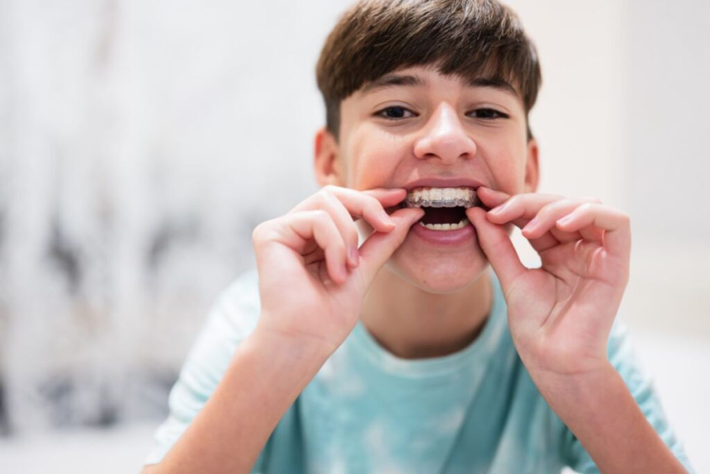 boy-wearing-Invisalign-clear-aligner